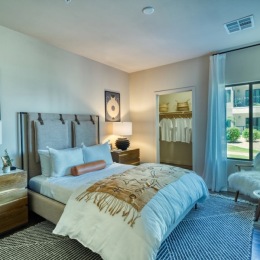 Seven a bedroom with tall ceilings