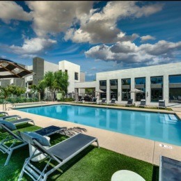 Seven poolside seating with blue skies