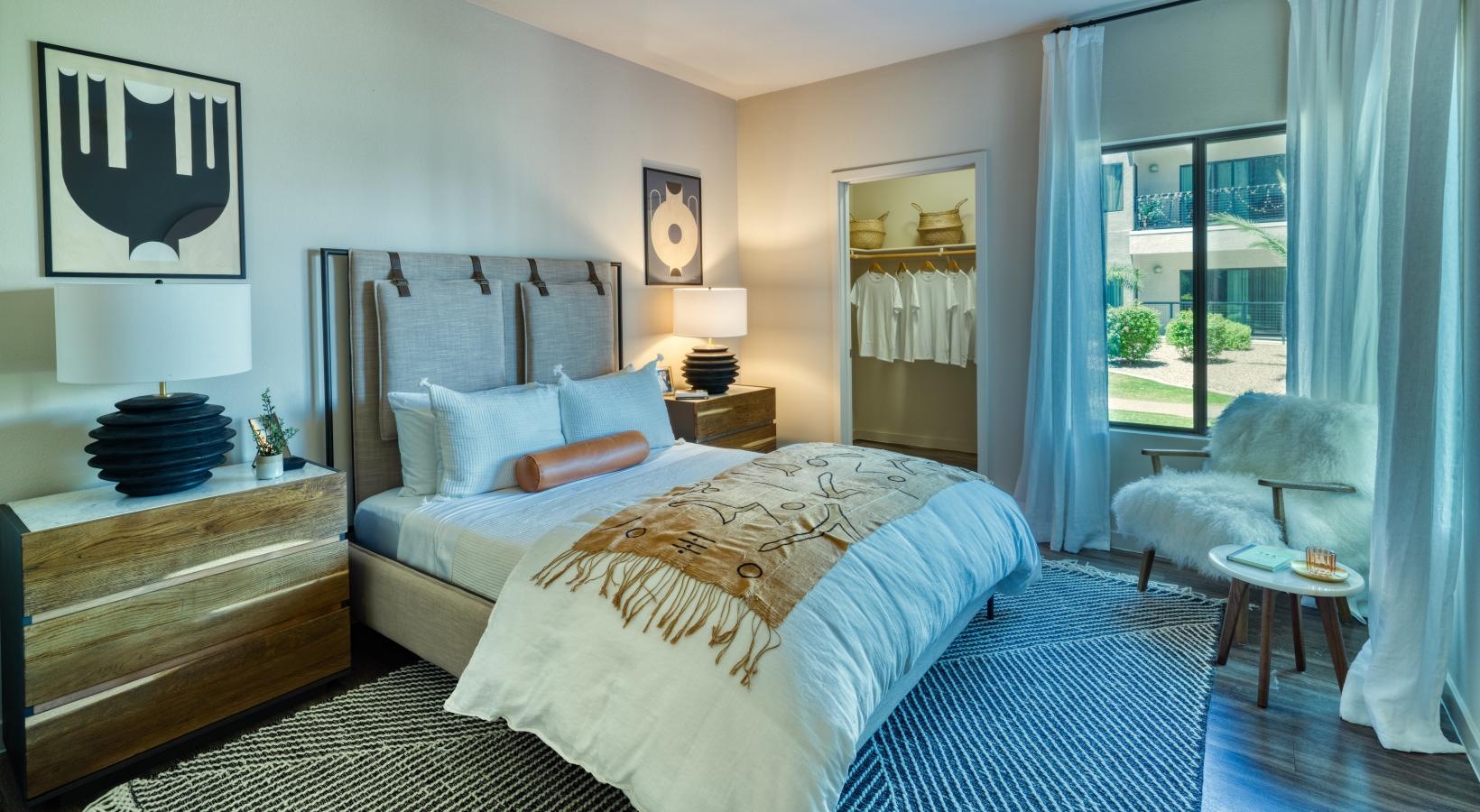 Relax and recharge in beautiful and spacious bedrooms a bedroom with a large window