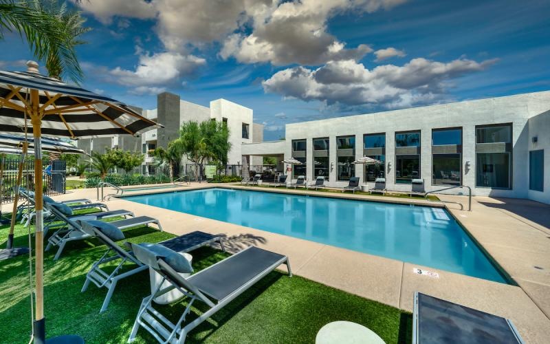 a pool with chairs around it